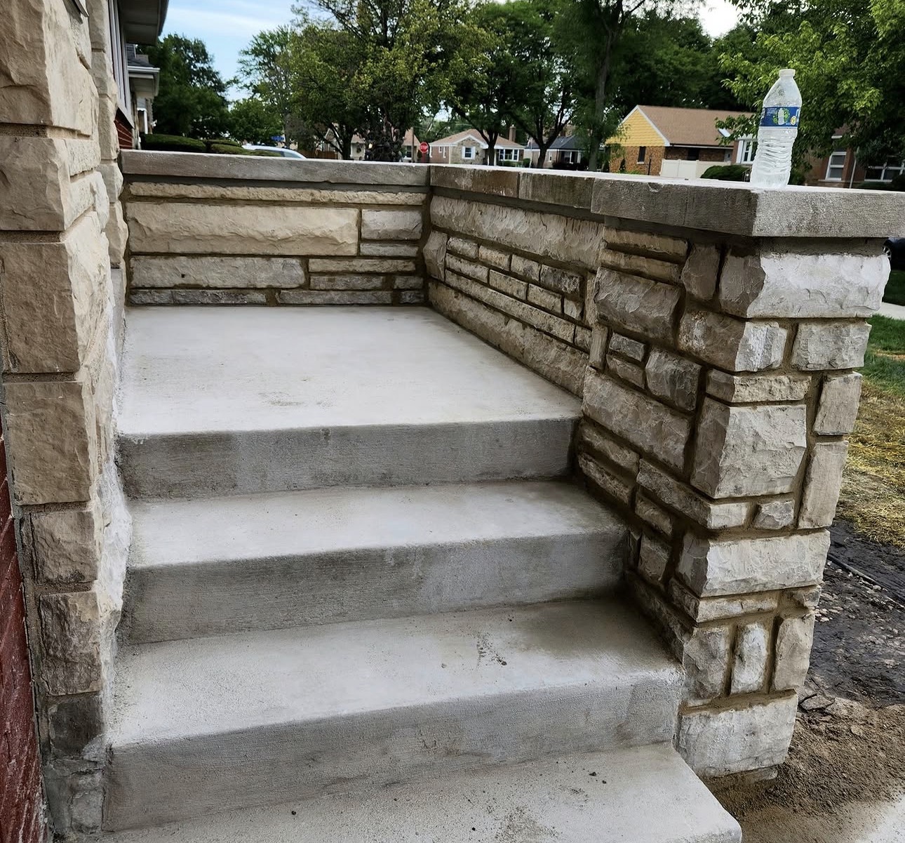 Custom stone veneer landing crafted by GB Masonry